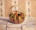 Nature morte Pommes et poires dans un panier rond postimpressionnisme Camille Pissarro